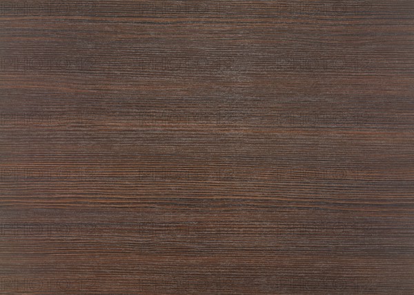 A full frame dark brown wood grain surface