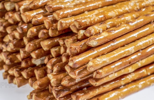 Closeup of some stacked salt sticks in light back
