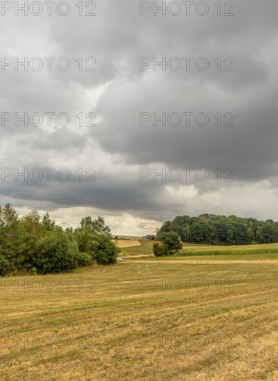 Stormy farmland scenery in Hohenlohe, an area in Southern Germany at late summer time