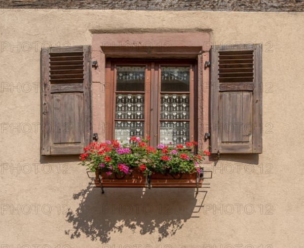Sunny illuminated window seen in Kaysersberg, a historical town and former commune in Alsace in northeastern France