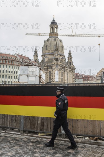 DEU Germany Germany Dresden Celebration of German unity in the 26th year of reunification Police officer in front of the Church of Our Dear Lady
