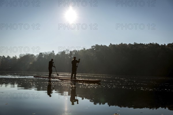 DEU Germany Germany Berlin Standup paddler (SUP) on the Krumme Lanke