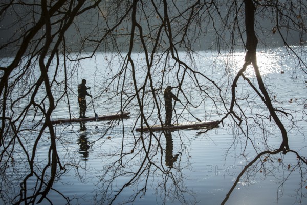 DEU Germany Germany Berlin Standup paddler (SUP) on the Krumme Lanke