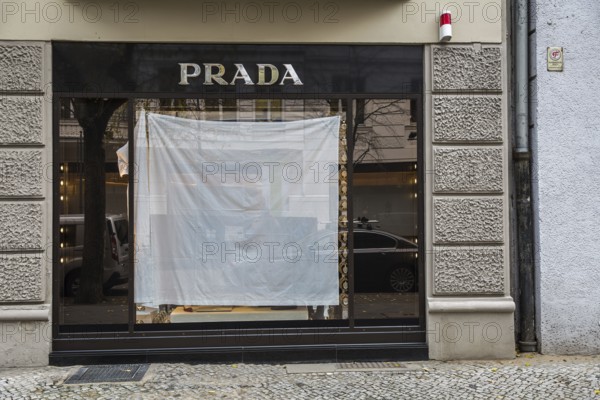 DEU Germany Germany Berlin A shop window of the luxury fashion company Prada is covered with a white sheet during a remodelling project