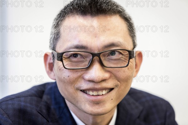 DEU Germany Germany Berlin Chinese billionaire Charles Chen Yidan during a meeting with Taz journalists