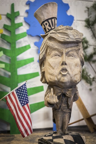 DEU Germany Germany Berlin The bust of US President Donald Trump, made by a chainsaw artist, at the Green Week