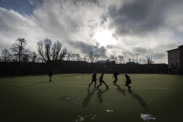 DEU Germany Germany Berlin Sports ground on Eisackstrasse in Berlin-Schöneberg. Refugees from a welcome class at a neighbouring school play football