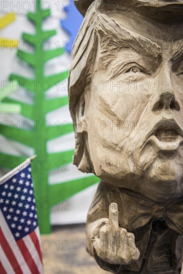 DEU Germany Germany Berlin The bust of US President Donald Trump, made by a chainsaw artist, at the Green Week