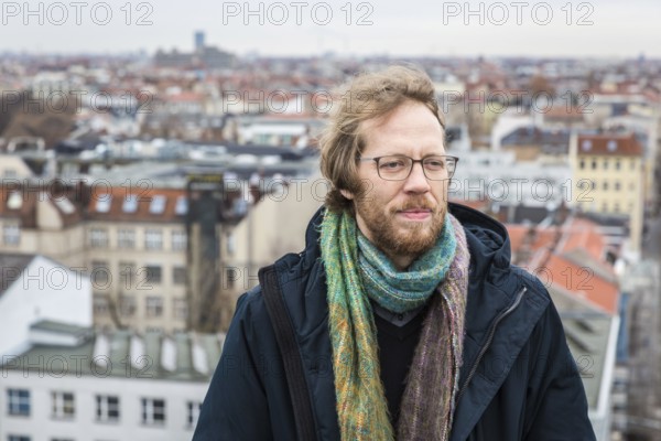 DEU Germany Germany Berlin The city councillor for Kreuzberg-Friedrichshain, Florian Schmidt, poses on the roof of the old town hall in Kreuzberg