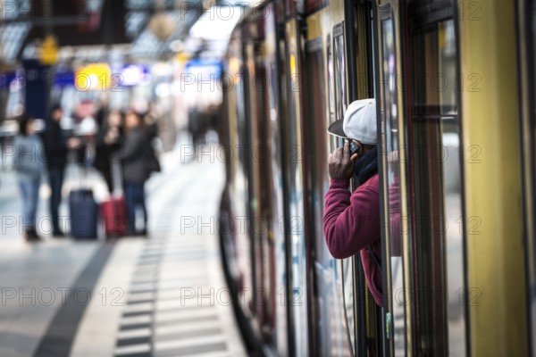 DEU Germany Germany Berlin A traveller makes a phone call from an S-Bahn train at the main station during the EVG strike on Monday morning