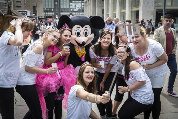 DEU Germany Germany Berlin Selfie with Mickey Mouse actor during a bachelorette party on Alexanderplatz