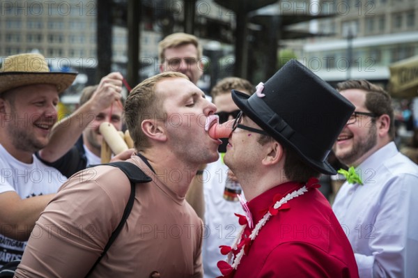 DEU Germany Germany Berlin The grooms of two bachelor parties exchange rituals during their meeting on Alexanderplatz