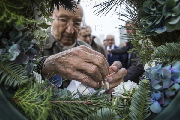 DEU Germany Germany Berlin Former Jewish concentration camp inmates join Polish schoolchildren in commemorating Kristallnacht with a wreath-laying ceremony at Wittenbergplatz