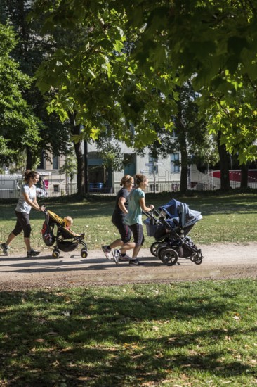 DEU Germany Germany Berlin Jogging mothers with prams in Monbijoupark in Mitte