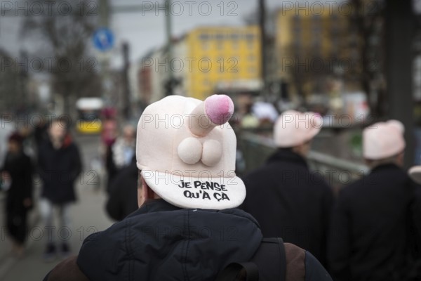 DEU Germany Germany Berlin A man wears a cap with a penis through Friedrichshain during a bachelor party
