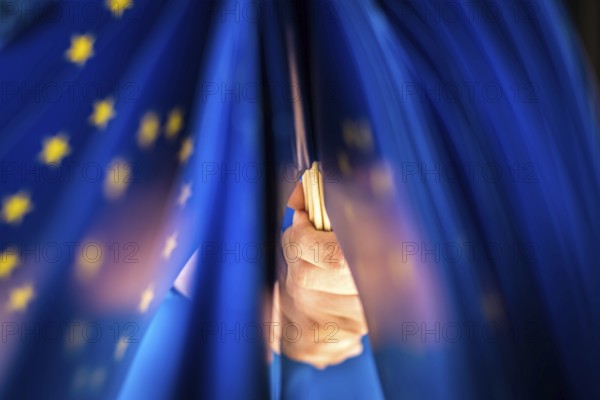 DEU Germany Germany Man with European flags in front of an info shop for Europe