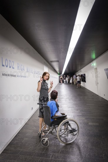 DEU Germany Germany Berlin Disabled tourist in a wheelchair explores Berlin with a city guide. Visit to the Jewish Museum