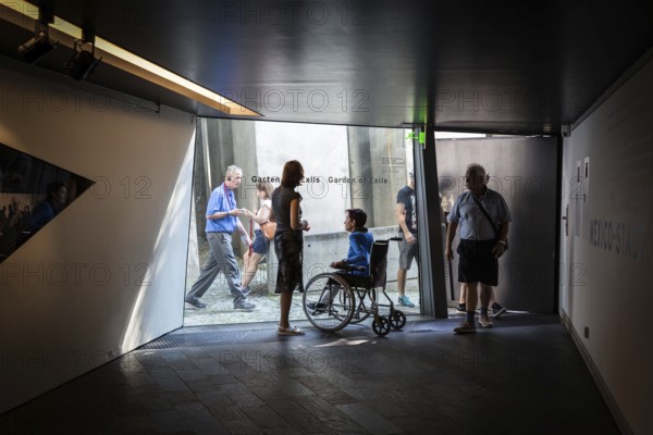 DEU Germany Germany Berlin Disabled tourist in a wheelchair explores Berlin with a city guide. Visit to the Jewish Museum