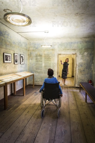 DEU Germany Germany Berlin Disabled tourist in a wheelchair explores Berlin with a city guide. Otto Weidt workshop for the blind in Berlin-Mitte