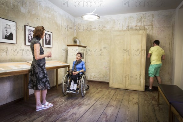 DEU Germany Germany Berlin Disabled tourist in a wheelchair explores Berlin with a city guide. Otto Weidt workshop for the blind in Berlin-Mitte