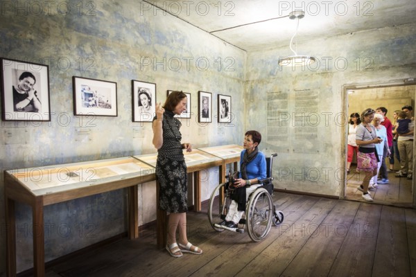 DEU Germany Germany Berlin Disabled tourist in a wheelchair explores Berlin with a city guide. Otto Weidt workshop for the blind in Berlin-Mitte