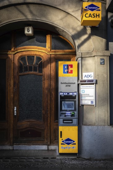 DEU Germany Germany Berlin An ATM stands in front of the entrance to an old building on Hohenzollerndamm