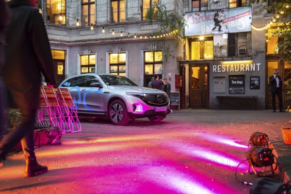 DEU Germany Germany Berlin Spotlights bathe the entrance to Clärchens Ballhaus in red light. Part of a Mercedes Benz promotional event for the new EQ electric car