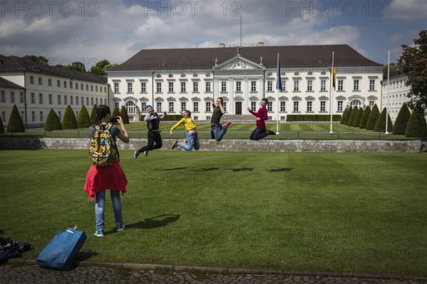DEU Germany Germany Berlin Tourists pose for a photo in front of Bellevue Palace, the seat of the Federal President