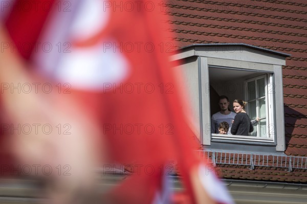 DEU Germany Germany Berlin Election campaign appearance of SPD chancellor candidate Martin Schulz. Family watches the election rally from the window of their penthouse flat