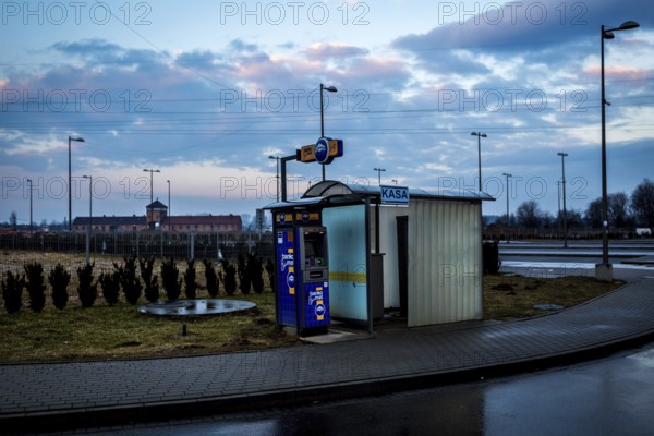 POL Poland Auschwitz Scenes at the Holocaust Memorial .ATM-machine and ticket machine at the central parking.each year more than 2 million visitors are touring through the remains of the former German Nazi concentration and extermination camp Auschwitz-Birkenau. POL Poland Auschwitz Scenes at the Holocaust Memorial .ATM-machine and ticket machine at the central parking.Each year more than 2 million visitors are touring through the remains of the former German Nazi concentration and extermination camp Auschwitz-Birkenau. More than 1, 1 million people have been killed here between 1940 and 1945
