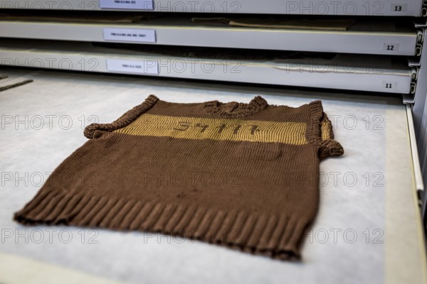POL Poland Auschwitz Photo series about the memorial site of the former Auschwitz-Birkenau concentration camp. Storage of found objects, here a child's jumper, in the conservation laboratory. POL Poland Auschwitz Scenes at the Holocaust Memorial Preserving laboratories with historical items like a childrens shirt. Each year more than 2 million visitors are touring through the remains of the former German Nazi concentration and extermination camp Auschwitz-Birkenau. More than 1, 1 million people have been killed here between 1940 and 1945