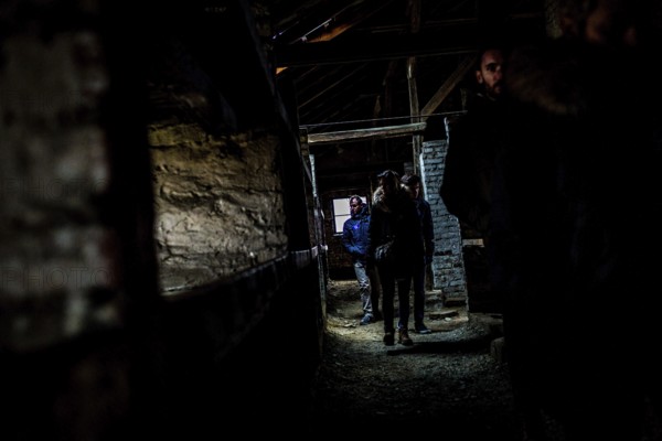 POL Poland Auschwitz Photo series about the memorial site of the former concentration camp Auschwitz-Birkenau.visitors in a death barrack. POL Poland Auschwitz Scenes at the Holocaust Memorial. Visitors in a barrack. Each year more than 2 million visitors are touring through the remains of the former German Nazi concentration and extermination camp Auschwitz-Birkenau. More than 1, 1 million people have been killed here between 1940 and 1945
