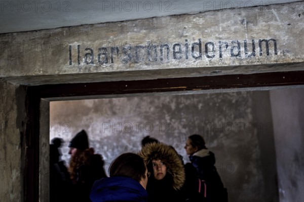 POL Poland Auschwitz Scenes at the Holocaust Memorial .Visitor entering the room for haircuts in the socalled Sauna. POL Poland Auschwitz Scenes at the Holocaust Memorial .Visitor entering the room for haircuts in the socalled Sauna.Each year more than 2 million visitors are touring through the remains of the former German Nazi concentration and extermination camp Auschwitz-Birkenau. More than 1, 1 million people have been killed here between 1940 and 1945