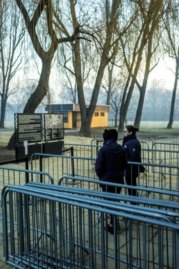 POL Poland Auschwitz Photo series about the memorial site of the former Auschwitz-Birkenau concentration camp. Staff waiting for visitors in front of the entrance in the early morning. POL Poland Auschwitz Scenes at the Holocaust Memorial .Waiting for tourist early morning.Each year more than 2 million visitors are touring through the remains of the former German Nazi concentration and extermination camp Auschwitz-Birkenau. More than 1, 1 million people have been killed here between 1940 and 1945