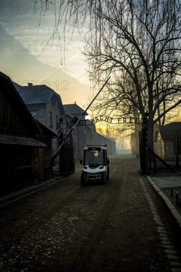 POL Poland Auschwitz Photo series about the memorial site of the former Auschwitz-Birkenau concentration camp. Early morning sunset at the entrance. POL Poland Auschwitz Scenes at the Holocaust Memorial .Early morning sunset at the entrance.Each year more than 2 million visitors are touring through the remains of the former German Nazi concentration and extermination camp Auschwitz-Birkenau. More than 1, 1 million people have been killed here between 1940 and 1945