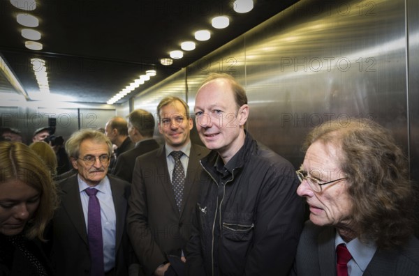 DEU Germany Germany Berlin Trial against Die Partei begins at the Berlin Administrative Court. The German Bundestag is demanding the return of subsidies that the satirists' party had received from the federal government through the 'Buy Money' campaign. In the lift from left: lawyers Morlock and Rosener, Martin Sonneborn and treasurer Norbert Gravius