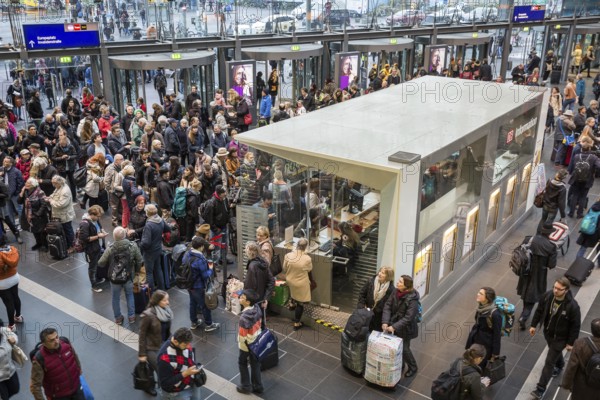 DEU Germany Germany Berlin Scenes at Berlin Central Station after storm Xavier. All long-distance traffic was paralysed until midday. Travellers around the information desk
