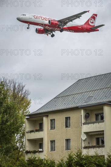 DEU Germany Germany Berlin Landing approach of an Air Berlin aircraft over residential buildings at Tegel Airport. The airline will cease flight operations on 28 October
