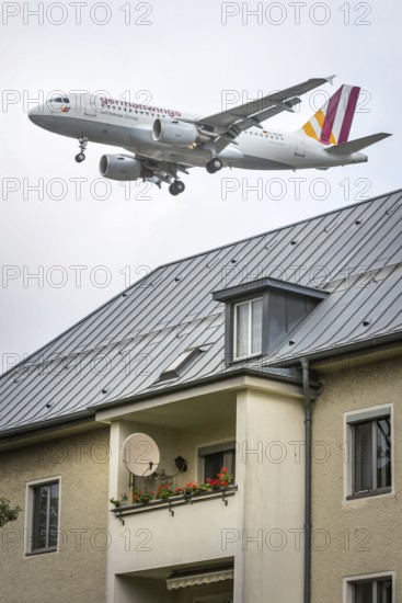DEU Germany Germany Berlin Landing approach of a German Wings aircraft over residential buildings at Tegel Airport