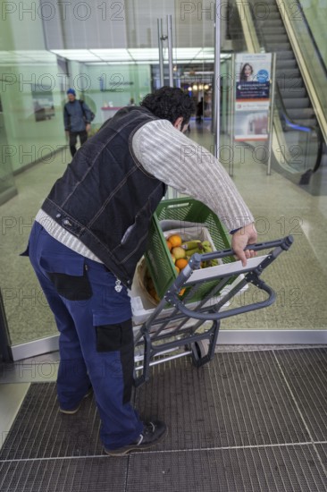 DEU Germany Germany Berlin A courier with food orders enters the European Centre