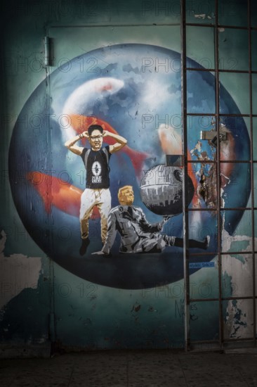 DEU Germany Germany Berlin A graffiti shows U.S. President Donald Trump and North Korean dictator Kim Jong Un in a ridiculous pose. A mural on the site of the former American surveillance station on the Teufelsberg