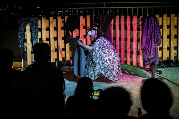 RWA RWANDA RUANDA Kigali A performance by the dancer Shema Isaak on the terrace of the Panorama Bar Ivy. He makes the loss of his family during the genocide a theme