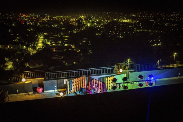 RWA RWANDA RUANDA Kigali A performance by the dancer Shema Isaak on the terrace of the Panorama Bar Ivy. He makes the loss of his family during the genocide a theme