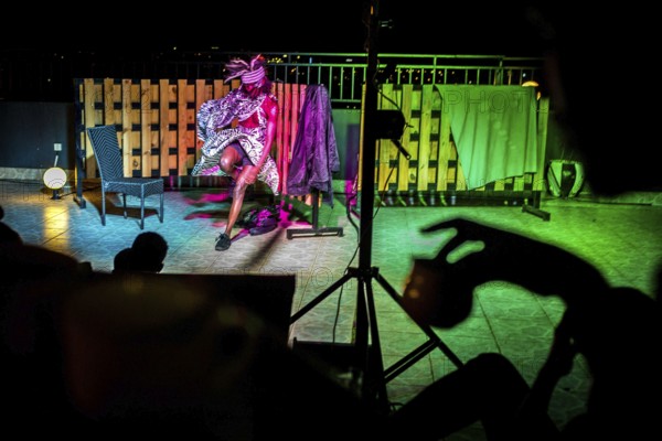 RWA RWANDA RUANDA Kigali A performance by the dancer Shema Isaak on the terrace of the Panorama Bar Ivy. He makes the loss of his family during the genocide a theme