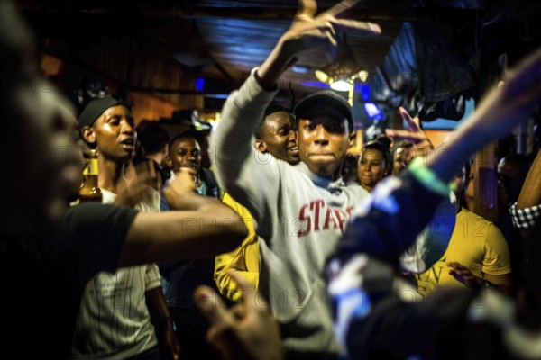 RWA RWANDA RUANDA Kigali Guests at a regular party organised by the Inema Gallery. Artists, locals and expats meet here every Thursday