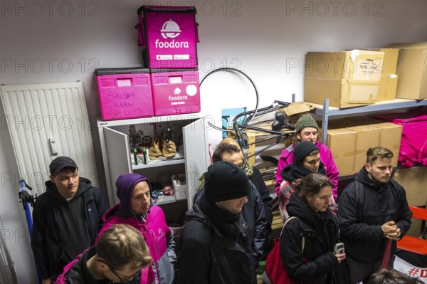 DEU Germany Germany Berlin Foodora bike couriers protest against poor working conditions and unequal pay in front of their distribution centre (hub) in Ackerstraße