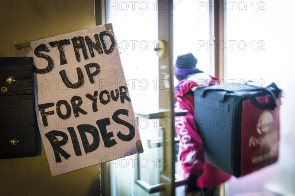 DEU Germany Germany Berlin Foodora bike couriers protest against poor working conditions and unequal pay in front of their distribution centre (hub) in Ackerstraße