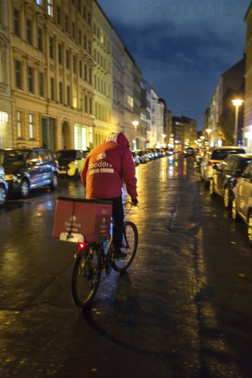 DEU Germany Germany Berlin Foodora bike couriers protest against poor working conditions and unequal pay in front of their distribution centre (hub) in Ackerstraße
