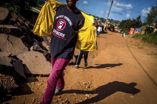 RWA RWANDA RUANDA Kigali A man wearing a shirt on a street in Gikondo district