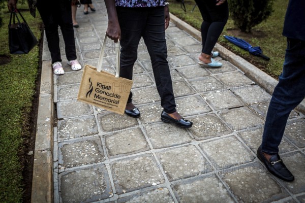 RWA RWANDA RUANDA Kigali A visitor carries a bag with the logo of the genocide memorial in her hand